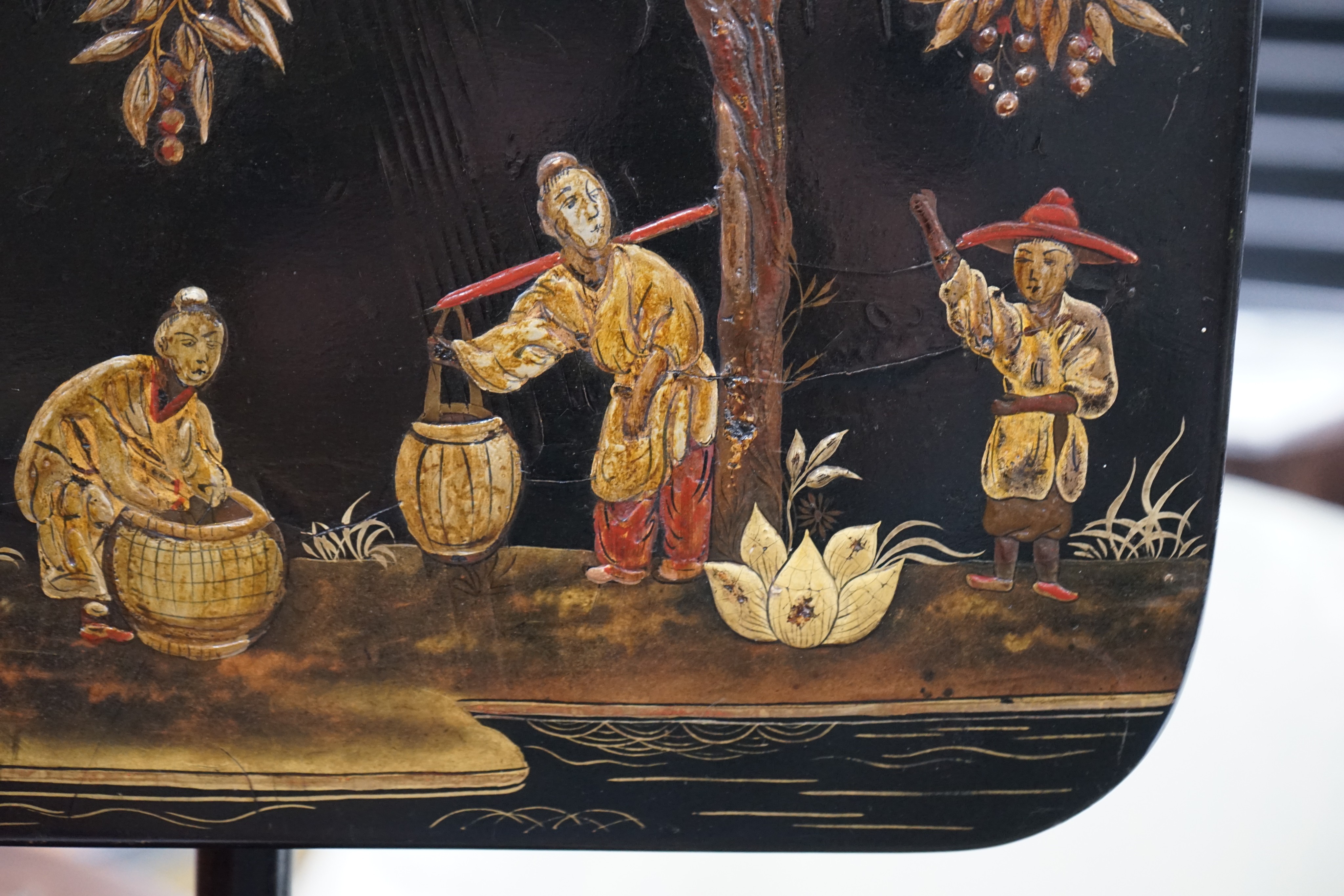 A pair of 19th century chinoiserie lacquer pole screens, height 152cm